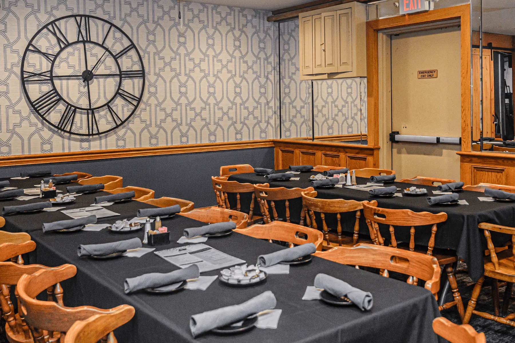 A Briarpatch private room set for a party, with a large wall clock